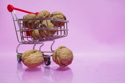 Close-up of fruits in basket on table