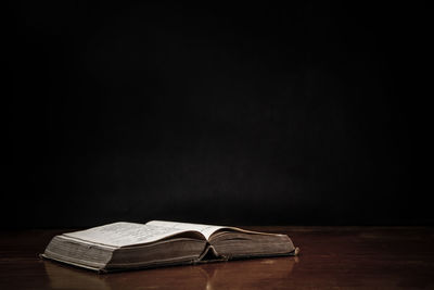 Close-up of table against black background