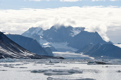 Scenic view of snowcapped mountains against sky