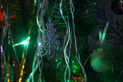 Close-up of christmas decorations at night