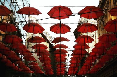 Low angle view of lanterns hanging against sky