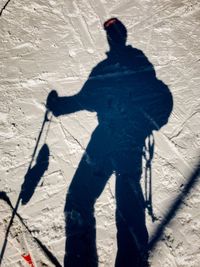 Shadow of man playing on the ground