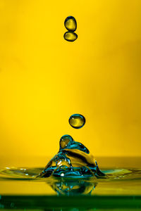 Close-up of drop falling in water