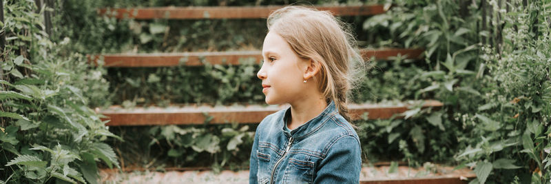 Happy candid kid girl in nature. prepubertal age of children, mind psychology and mental health