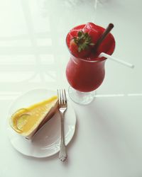 High angle view of dessert and juice on table