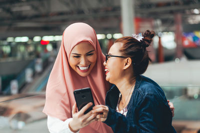 Young woman using mobile phone