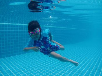 Girl swimming in pool