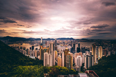 High angle view of buildings in city against sky during sunset