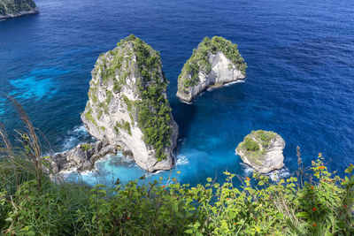 High angle view of rocks in sea