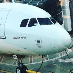 Close-up of airplane on airport runway