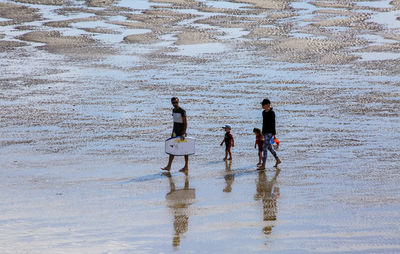 People enjoying on beach