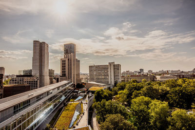 High angle view of buildings in city against sky