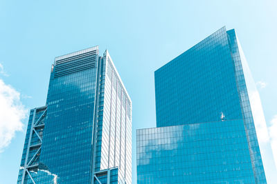 Low angle view of modern buildings against clear sky