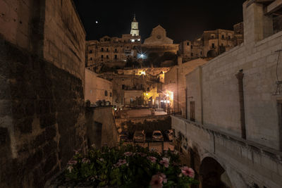 Illuminated buildings in city at night