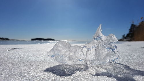 Close-up of snow against sky