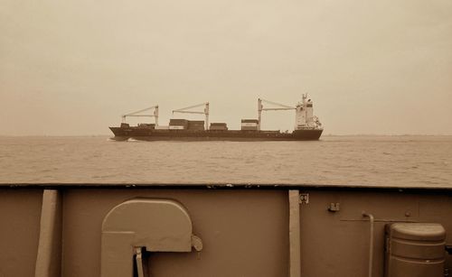 Ship in sea against sky