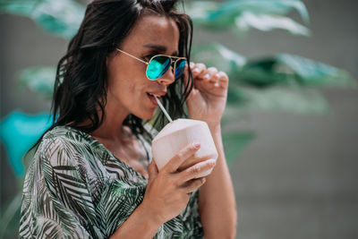 Portrait of a woman drinking water