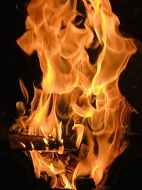 Close-up of bonfire on field at night