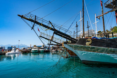 Boats moored at harbor