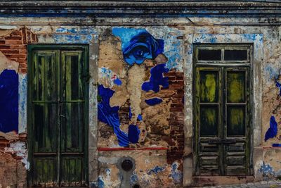 Graffiti on blue door