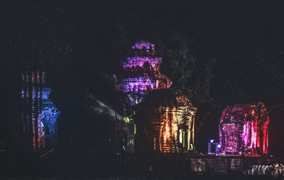 Low angle view of illuminated building at night