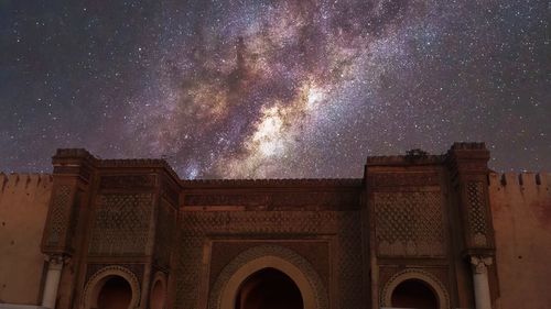 Low angle view of building against sky at night