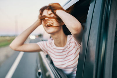 Portrait of woman in car