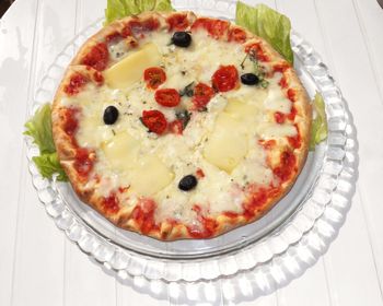 High angle view of pizza in plate on table
