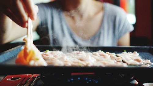 Midsection of woman having food