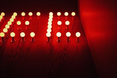 Close-up of illuminated lamp at night