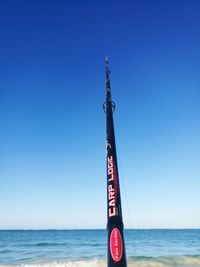 View of sea against clear blue sky