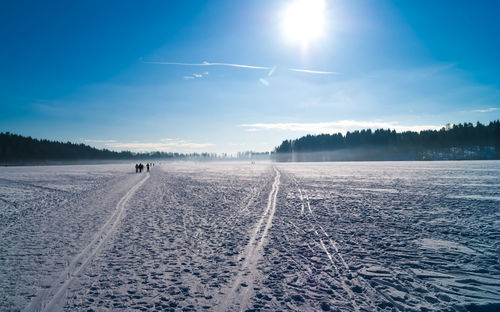 Scenic view of lake against sky during winter