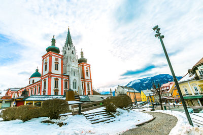 View of buildings against sky during winter