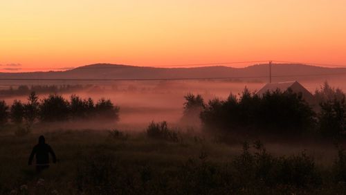 Scenic view of landscape against sky during sunset