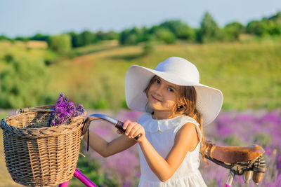 Portrait of girl wearing hat at farm