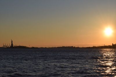 Scenic view of sea at sunset