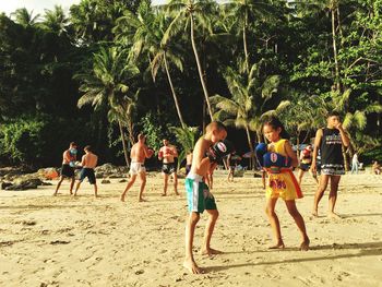 Group of people playing on beach