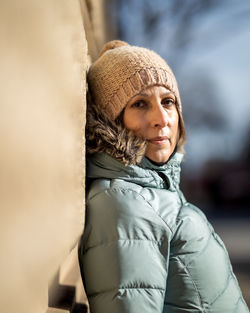 Portrait of young woman wearing hat