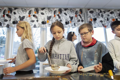 Children choosing food in school canteen