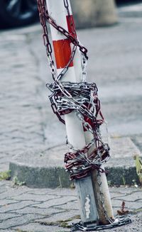 Close-up of rope tied to wooden post