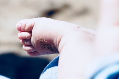 Low section of baby feet