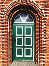 Closed window on brick wall of building