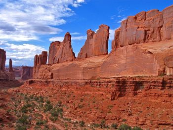 Scenic view of rock formations in arches national park against sky