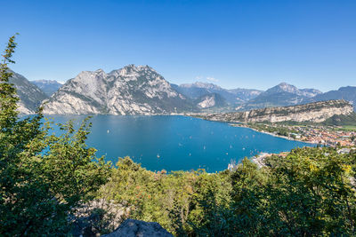 Scenic view of sea and mountains against sky