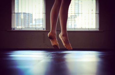 Low section of woman standing on floor