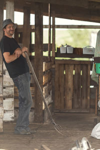 Local agriculture, farmer's day 12 october. a man black t-shirt with pitchfork, natural products