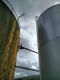 Low angle view of windmill against sky