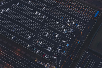 High angle view of cars parked in lot at night