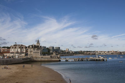 View of beach against cloudy sky