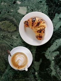 High angle view of cappuccino on table